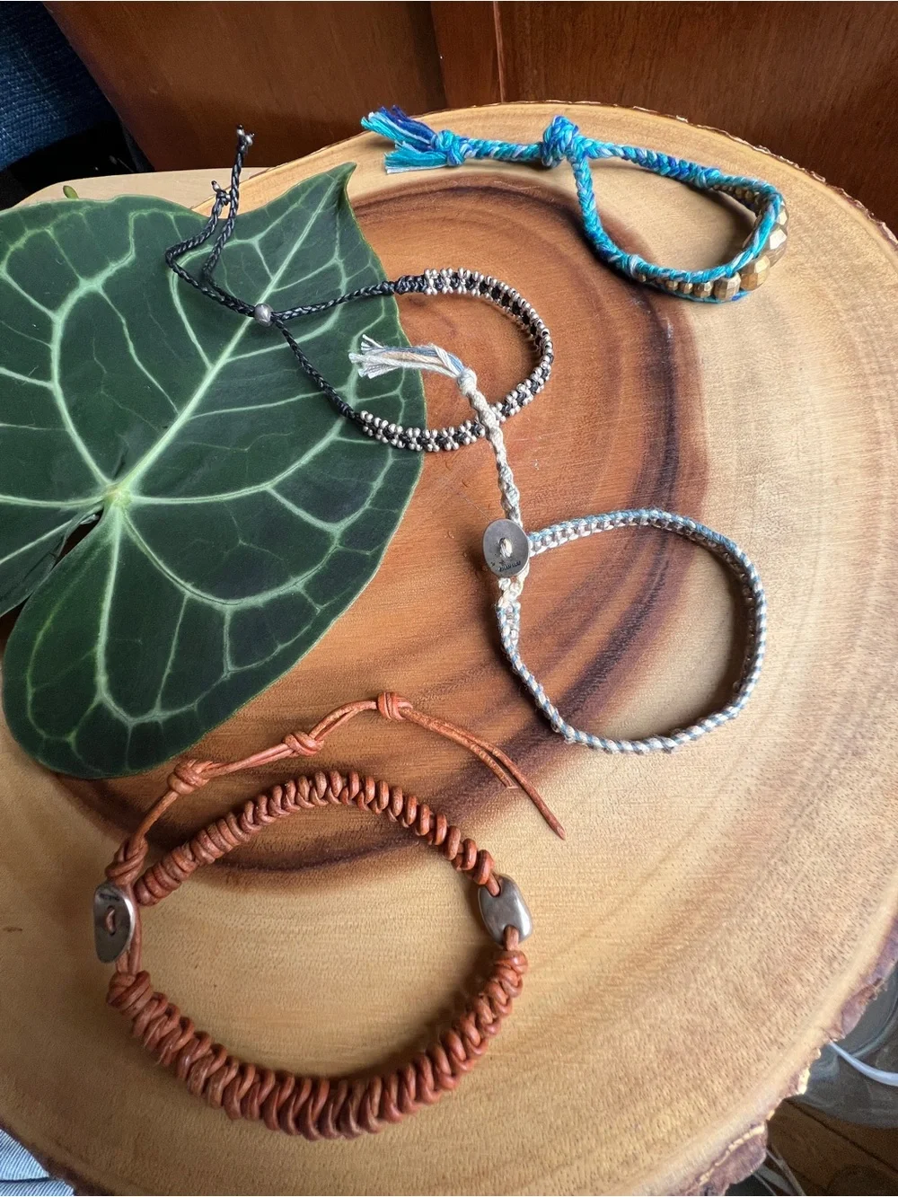 Set of Four. Stackable Beaded and Cord Bracelets - Blue, Brown, Silver, Gold
